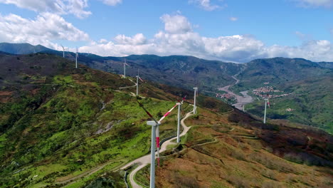 drone flight over wind turbines on mountain