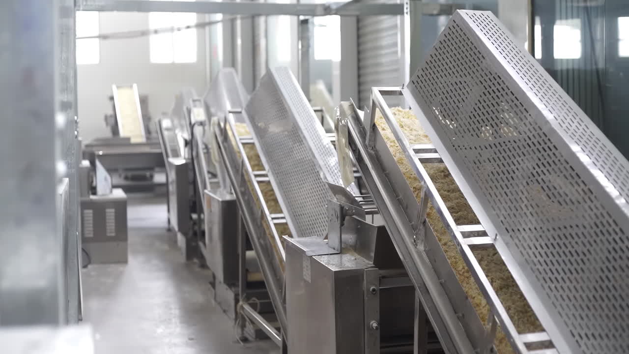 Cookie food cake factory on an assembly line, automated Cookies on a Conveyor Belt Production Line in a Factory, ready for packaging and distribution.