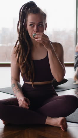 woman meditating with a crystal