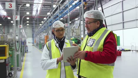 warehouse workers discussing together