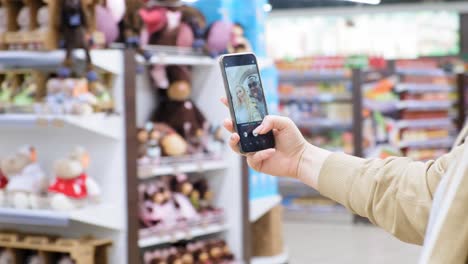 person taking a video call in a grocery store