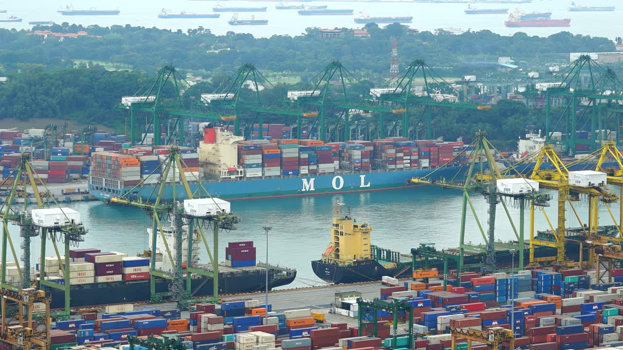 Singapore - Circa August  Time-lapse of a busy Singapore shipping port as cranes load a cargo ship.
