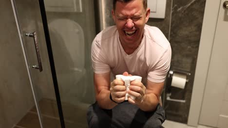 Man Straining on Toilet