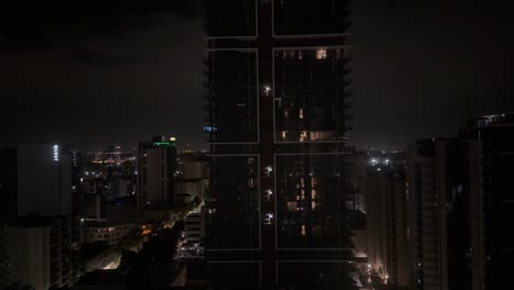 tall apartment building part in darkness