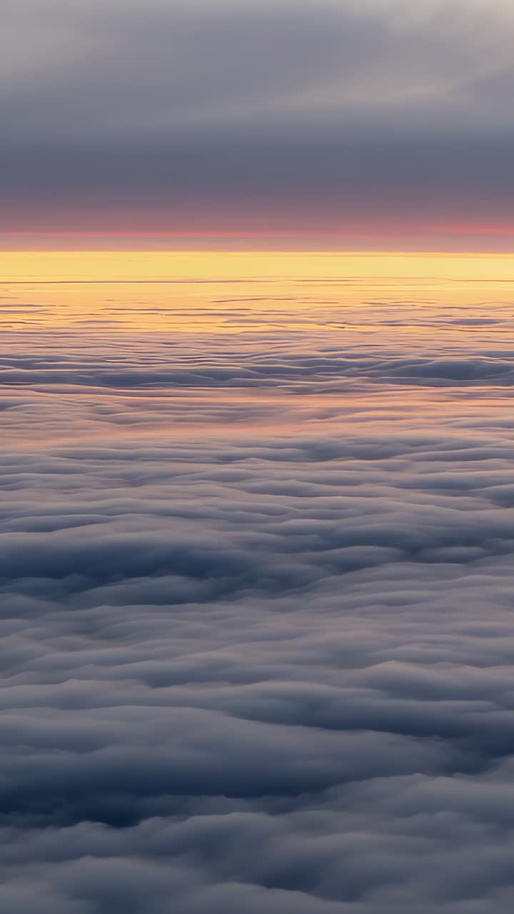 Vertical video: Glow intensifying at horizon line, cloud layer undulating at altitude, gradient sky