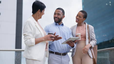 business people on balcony in city with tablet