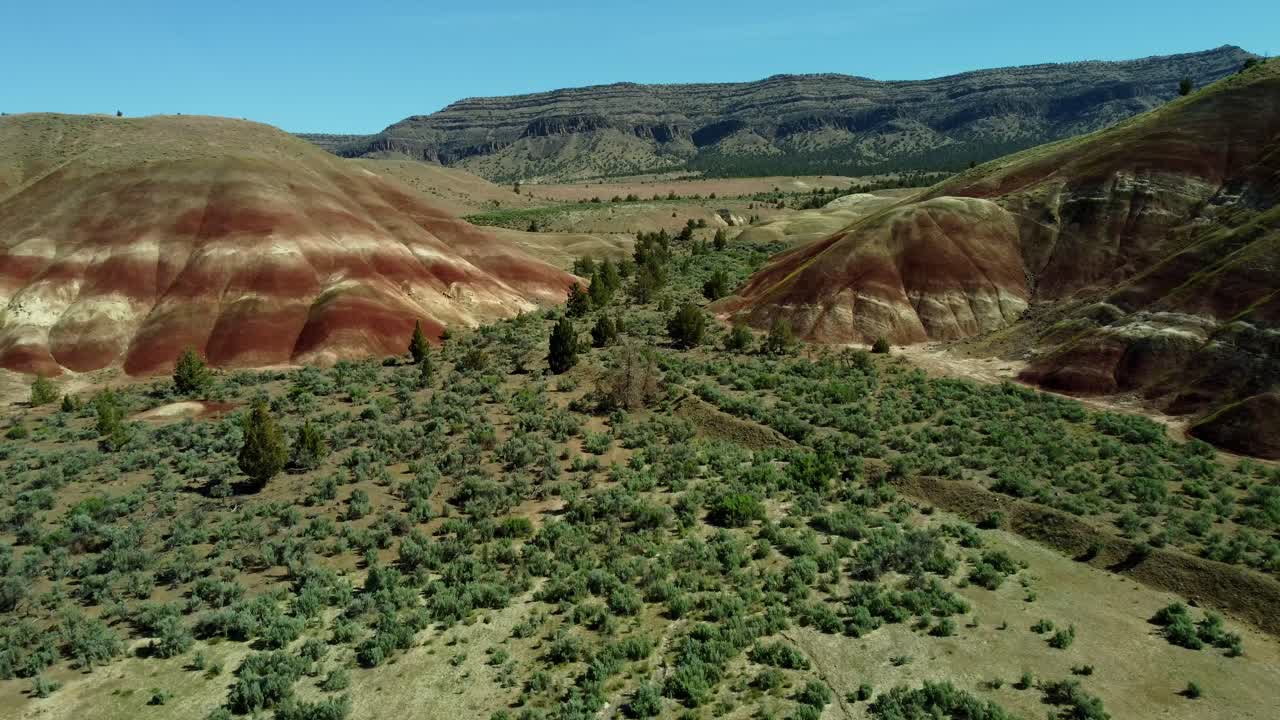 US, Oregon, Prineville, Painted Hills, 2025-05-06 - Drone view of the beautiful red soils just outside the John Day Fossil Beds National Monument