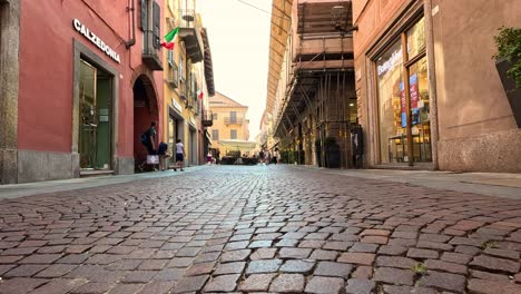 quiet alleyway with shops and cobblestones