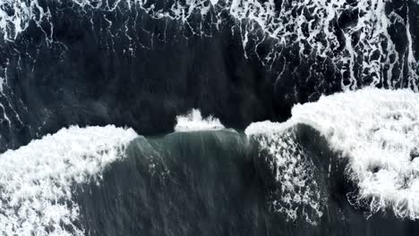 Waves-running-out-on-black-sand-beach