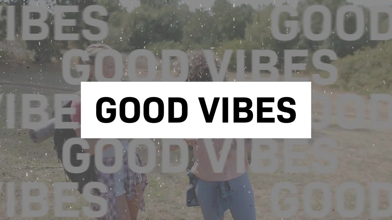 Vertical video: Animating GOOD VIBES overlay, two women walking and sharing smartphone on trail