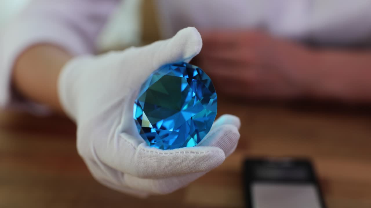 Blue Diamond Held in White Glove