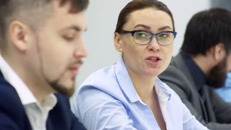 intelligent business lady talking at meeting