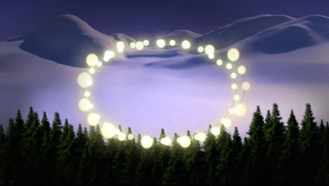 animation of fairy light frame with copy space over fir trees and winter scenery