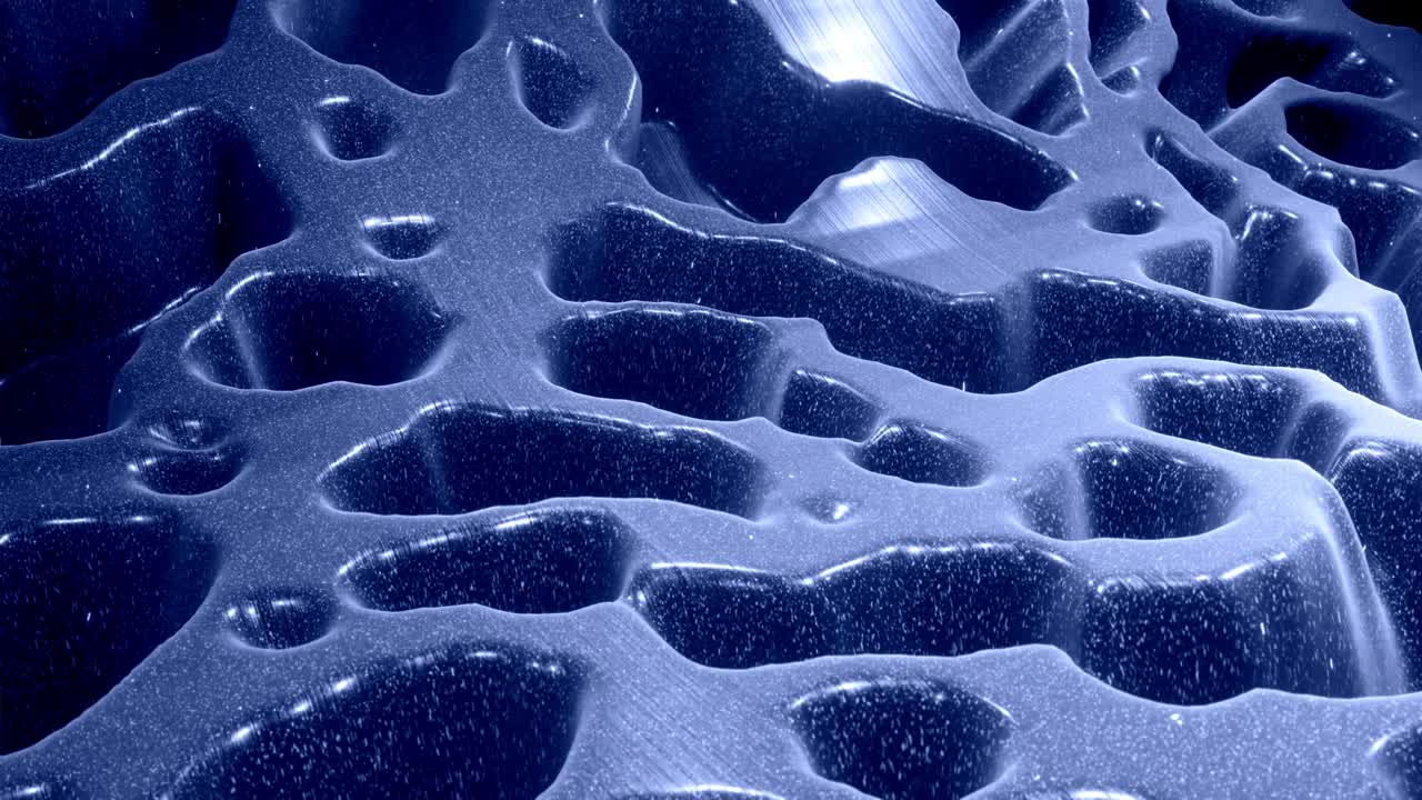 Stylish festive black bg. Fantastical abstract looped background, waves move on glossy surface like landscape made of liquid blue wax with sparkles. Beautiful soft background with smooth animation 4k