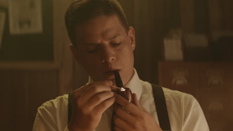 man lighting a pipe in a retro setting