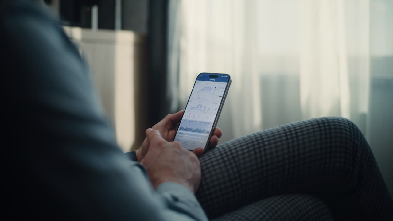 Close up happy attractive bearded businessman sit at desk working smiling and dance success on work. Use laptop at night office