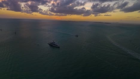 A-large-yacht-sails-as-the-sun-sets:-all-captured-via-a-drone-in-sharp-4K-resolution