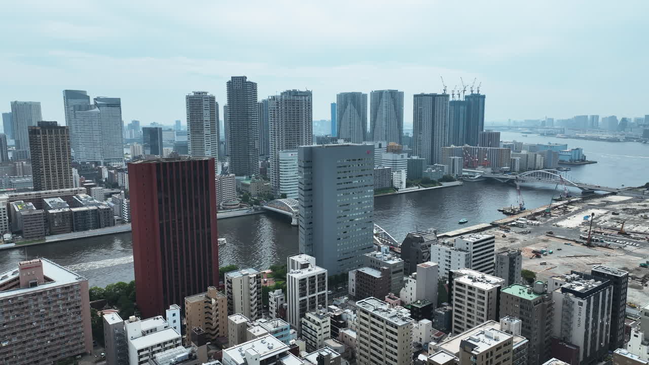 Kachidoki High-rise Buildings By Sumida River From Tsukiji District In Chuo, Tokyo, Japan. - aerial shot