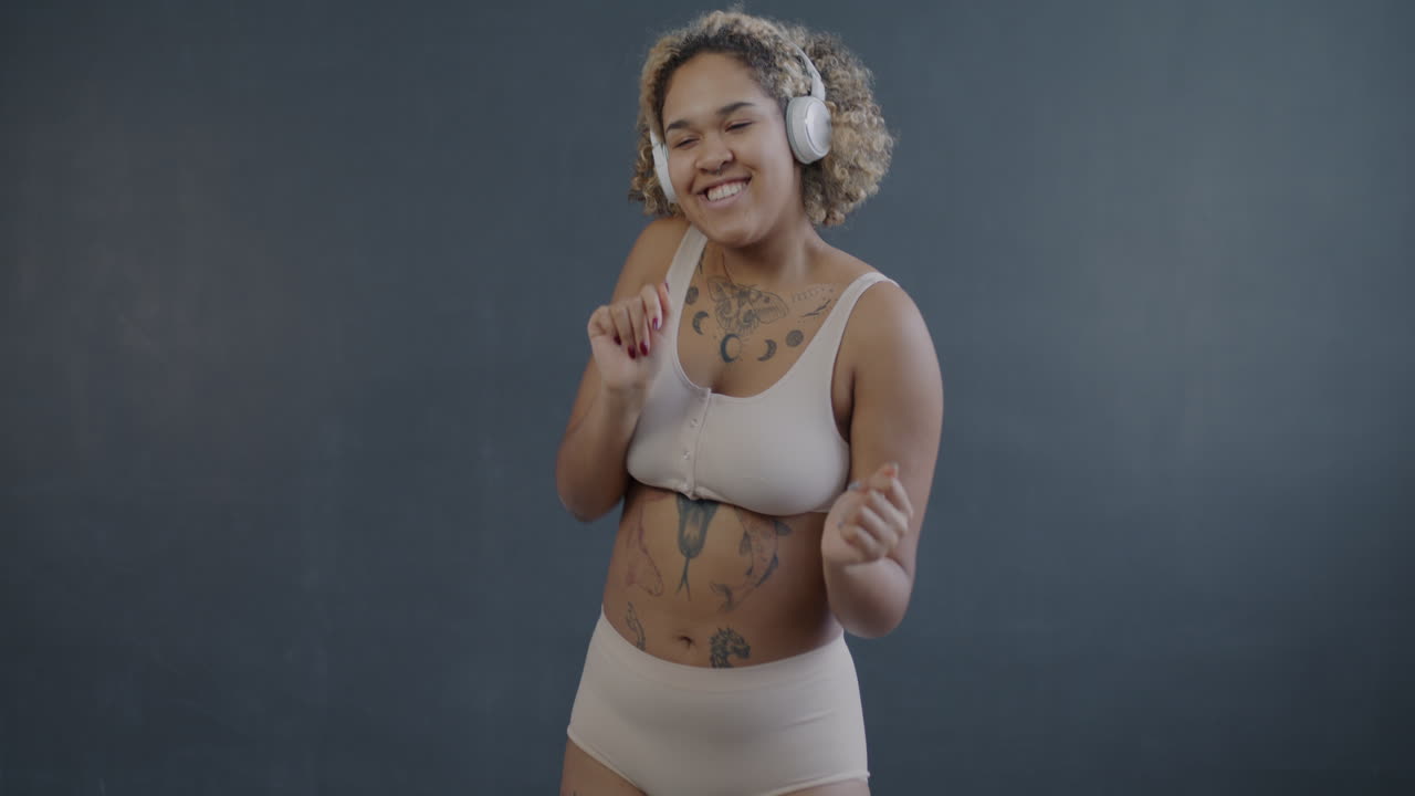 Woman Dancing and Enjoying Music