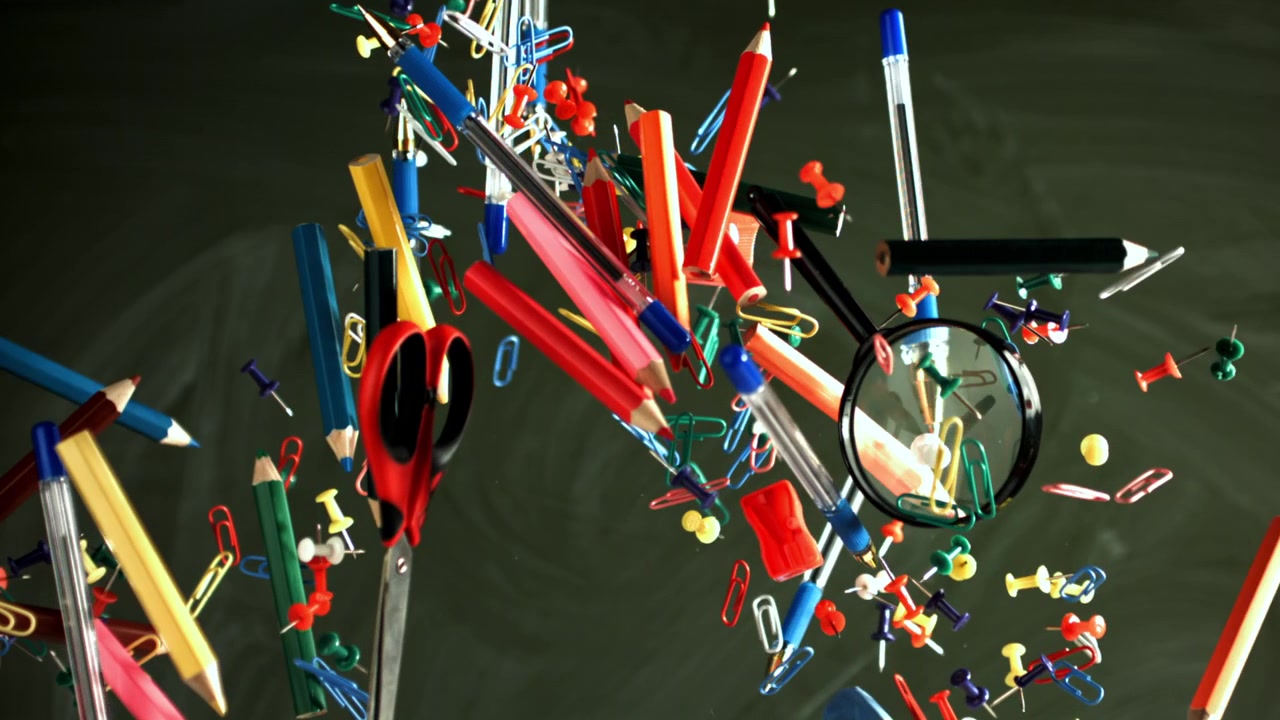 Colorful School and Office Supplies Floating in Slow Motion