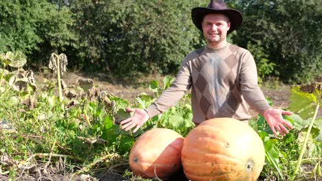farmer with large pumpkins