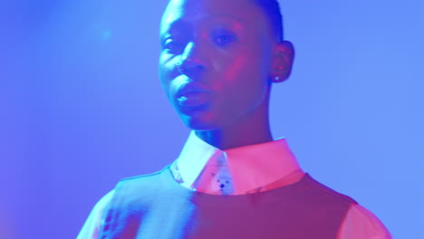 Dramatic-close-up-hero-shot-of-a-young-Black-model-with-red-blue-studio-lights