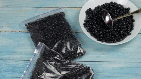 packages with blueberries in zipper plastic bags for freezing. frozen, preservation berries food