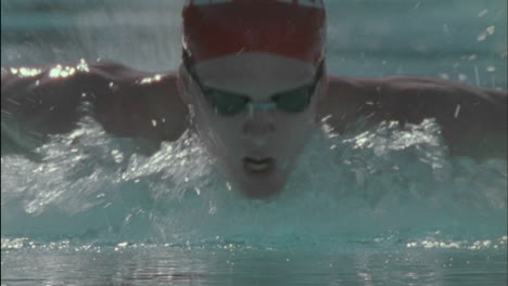 a man swims in a pool 1