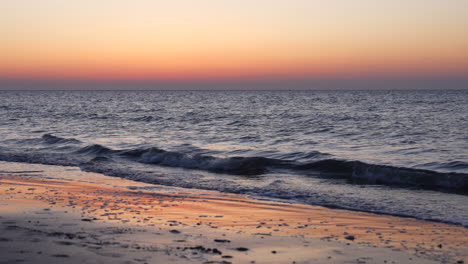 Sunset-Beach-With-Rolling-Waves-Onto-Shoreline.-Timelapse