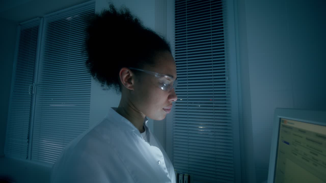 Female Scientist Working Late in a Laboratory
