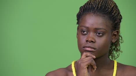 Young African woman thinking