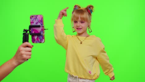 Stylish-kid-girl-making-trendy-dance-video-for-social-media-network,-child-dancing,-funny-blogger