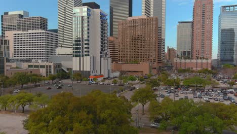 ascending drone shot of skyscrapers and the downtown houston area