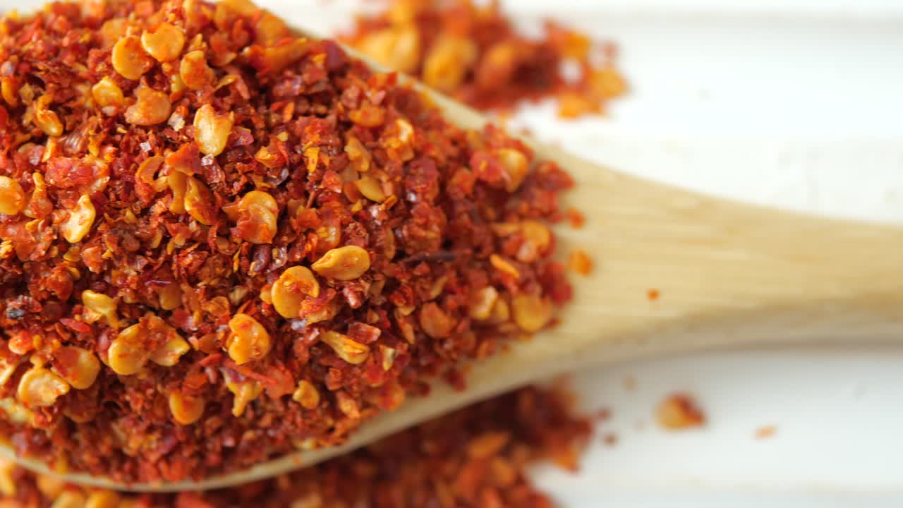 Red Chili Flakes in Wooden Spoon