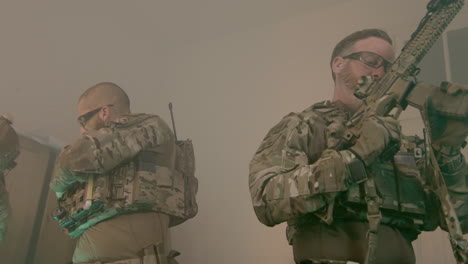 concentrated soldiers in bulletproof vests testing rifles