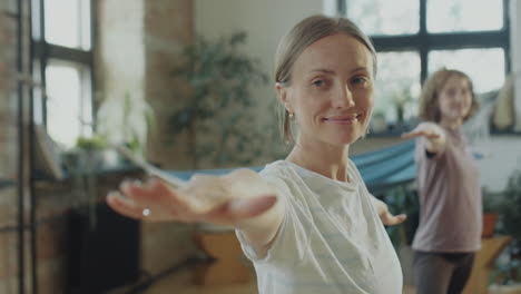woman doing yoga asana on group class