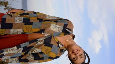 stylish woman dancing in countryside