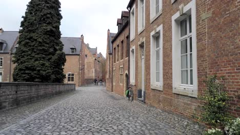 walking in the beguinage of leuven, belgium