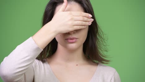 young beautiful woman covering eyes as three wise monkeys concept