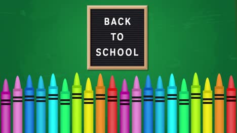 Back-To-School-text-against-multiple-colored-crayons-on-green-background