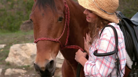 pretty woman petting a horse