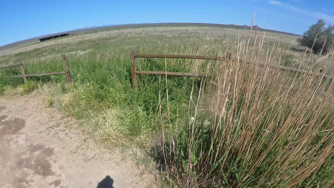 Utah basin with grass and wood fences