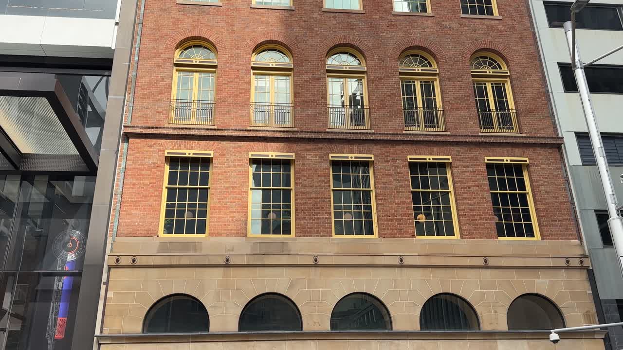 Sydney red brick stone arch windows building CBD city NSW Australia wide front