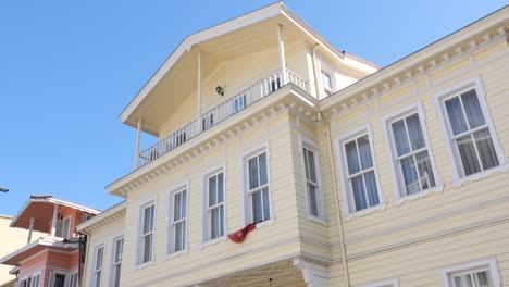 yellow wooden building with balcony
