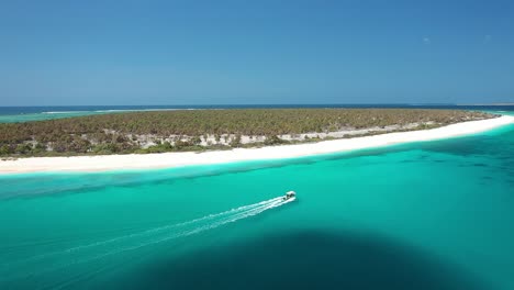 Excellent-Aerial-Shot-Of-A-Small-Boat-Approaching-The-Rote-Islands-Of-Indonesia