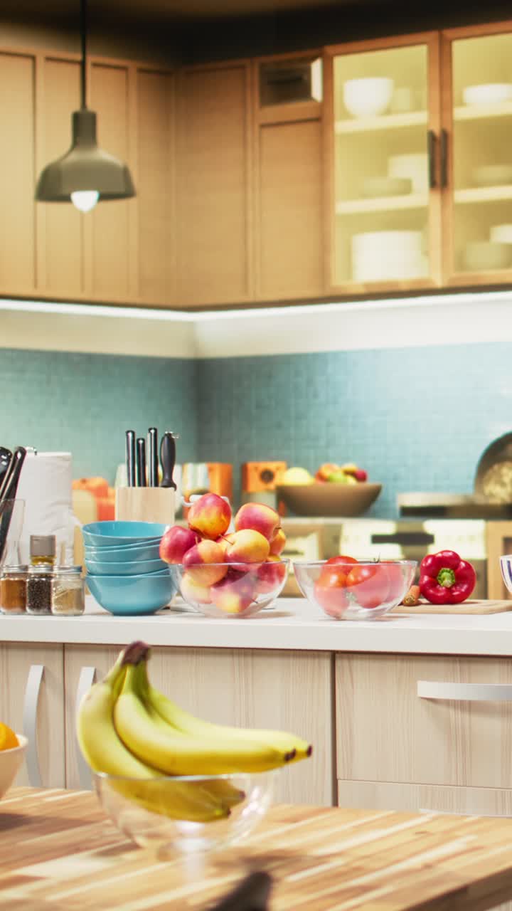 Vertical Video Empty kitchen with wooden dining furniture and modern appliances