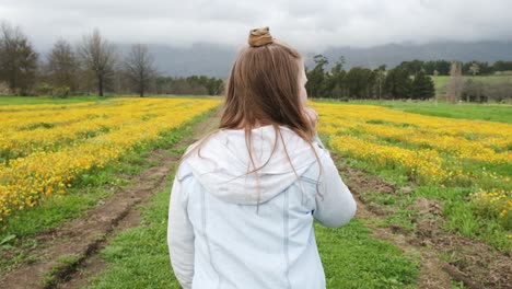 following young active girl walking slow motion in quiet countryside wilderness