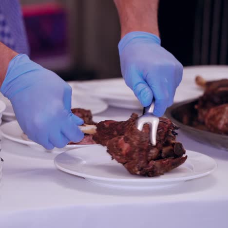 waiter serving meat at restaurant