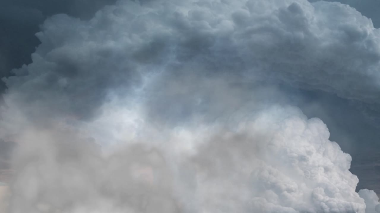 aerial view of Thunderstorm over the thick cumulonimbus clouds in the sky