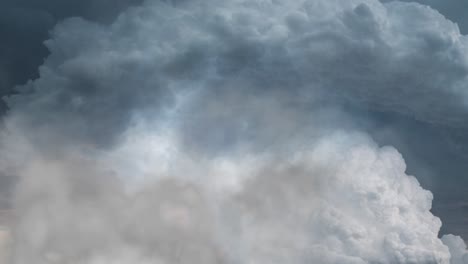 aerial view of thunderstorm over the thick cumulonimbus clouds in the sky